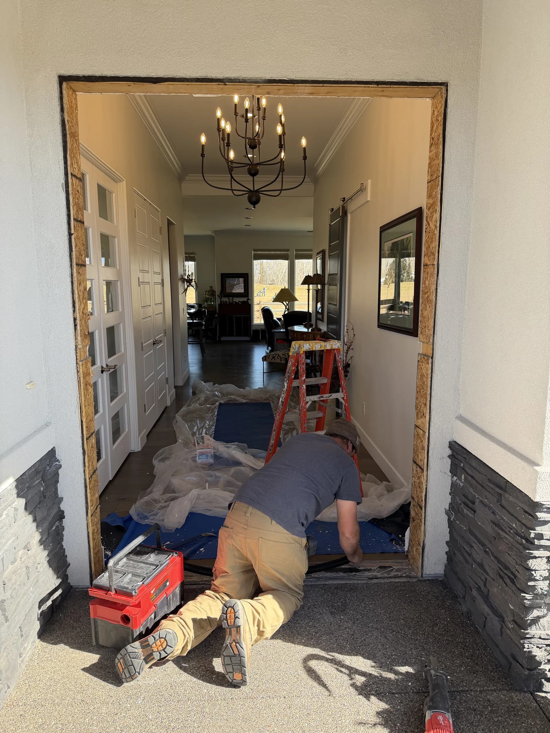 Black double entry doors with sidelights installed on a Western Colorado home