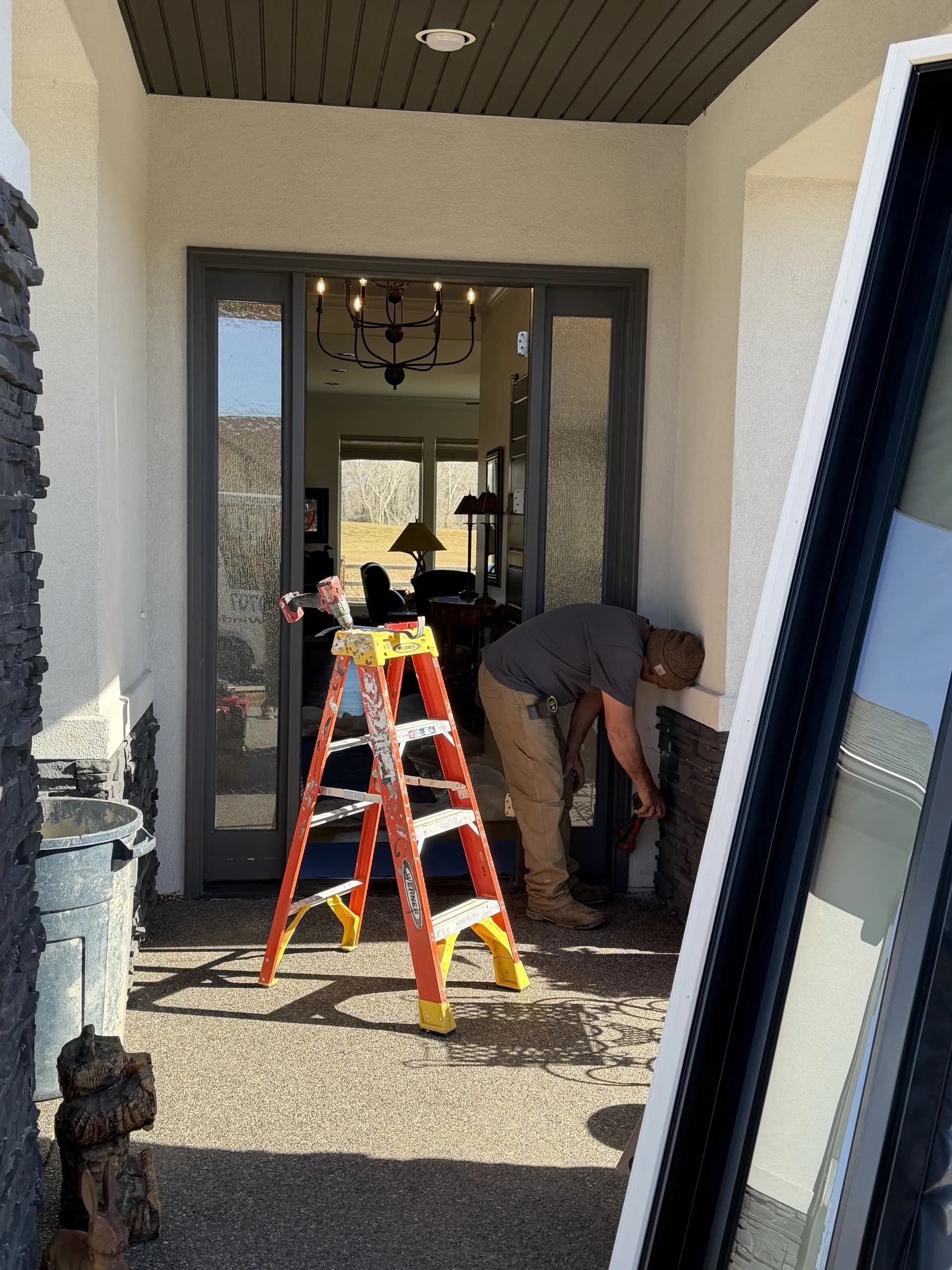Black french glass doors installed in a bright Western Colorado home interior