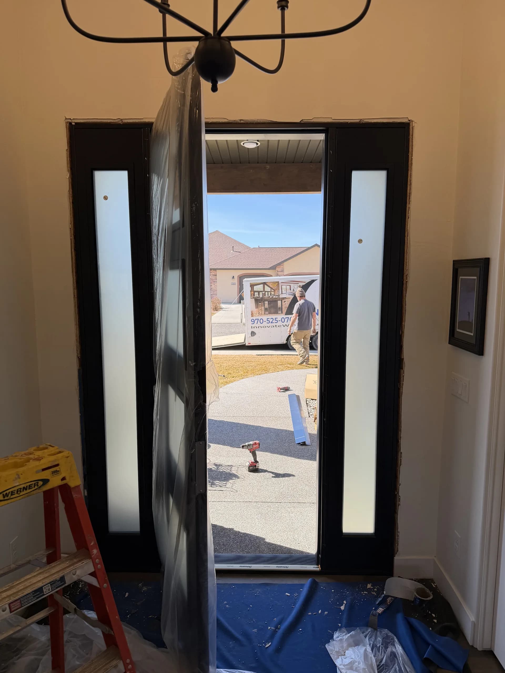 Commercial hollow metal double doors with glass panels installed at a Montrose, CO facility