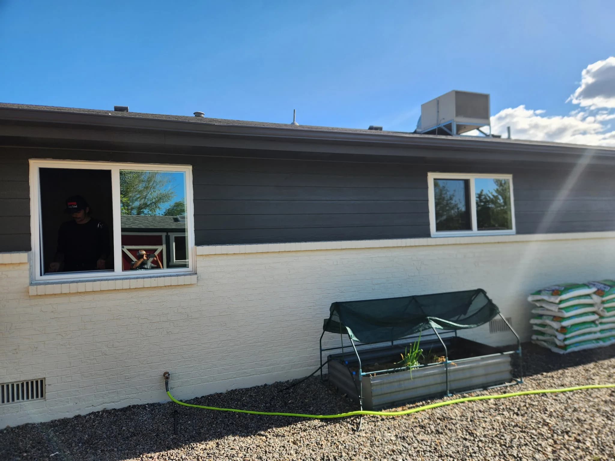 New vinyl replacement window installed on a home exterior in Western Colorado
