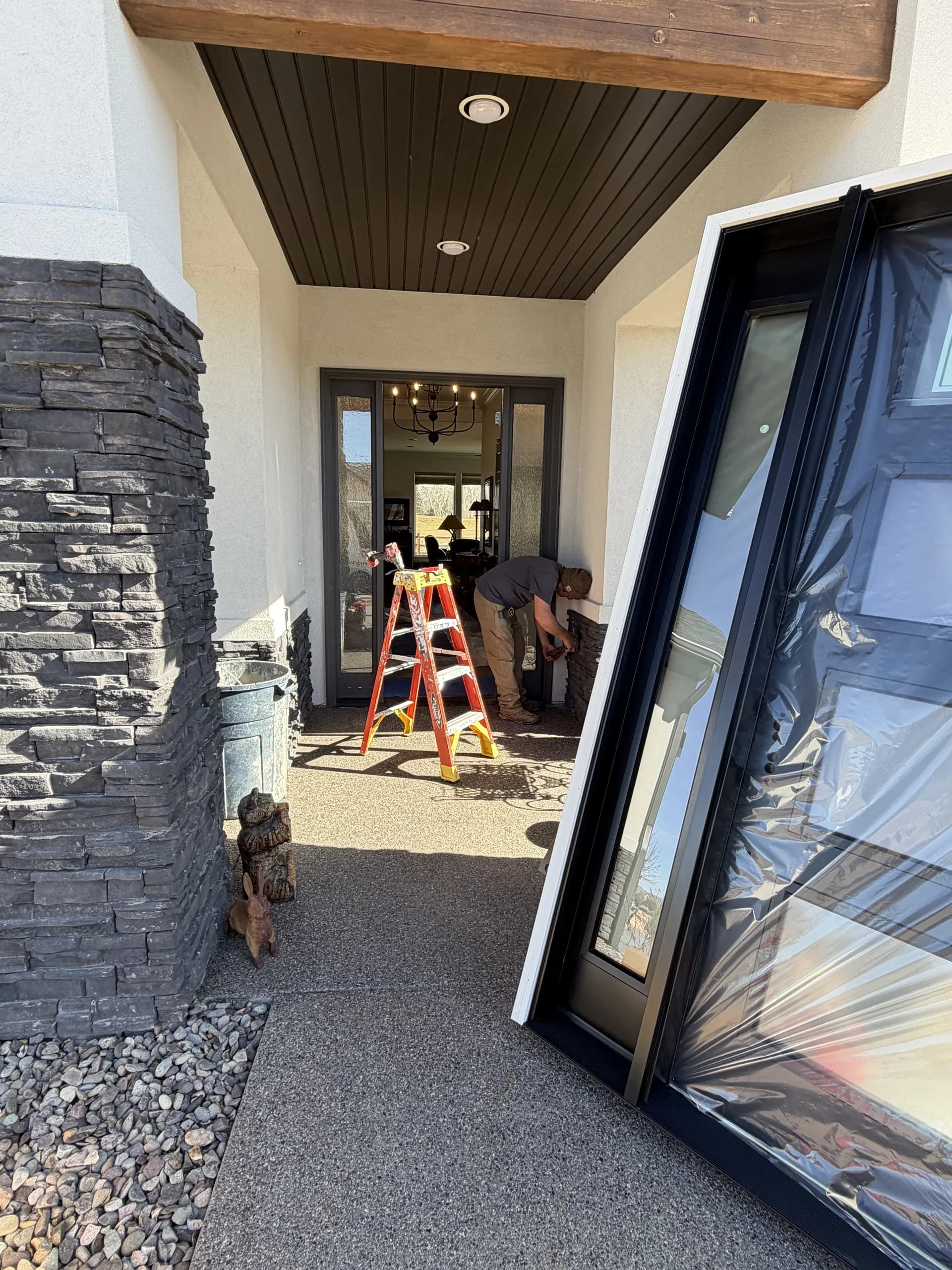 Modern commercial glass entry doors during installation