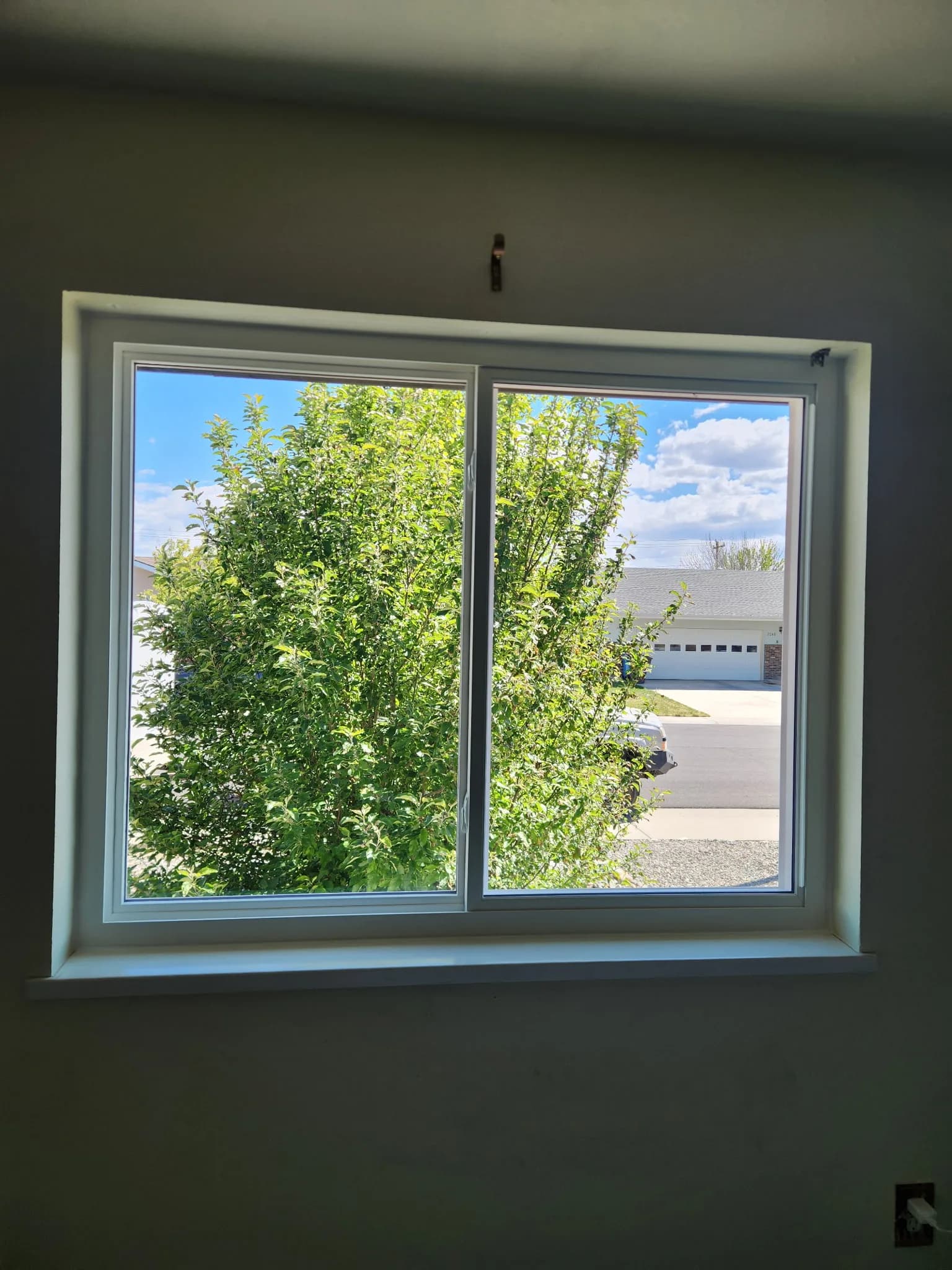 Vinyl sliding window viewed from the interior of a Western Colorado home