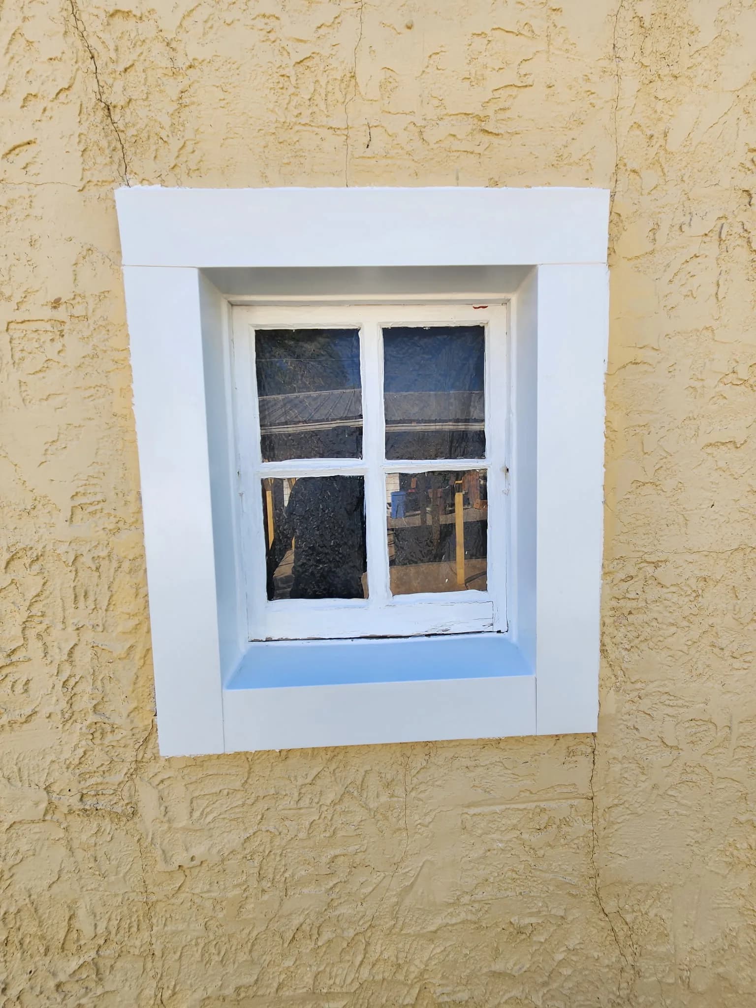 Vinyl window in a stucco wall on a Colorado home